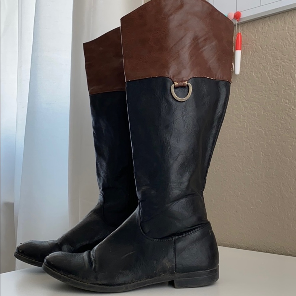 lightly worn brown and black riding boots